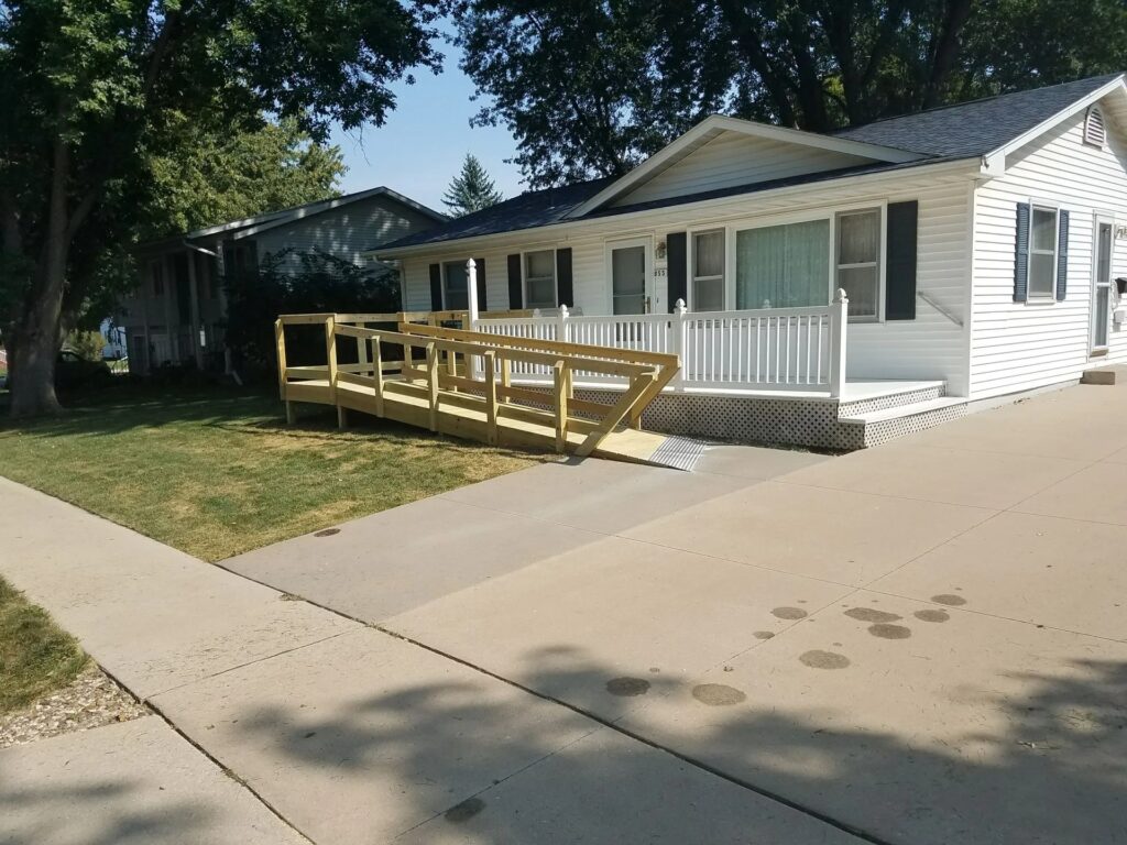 cedar rapids ranch home exterior with new siding and deck